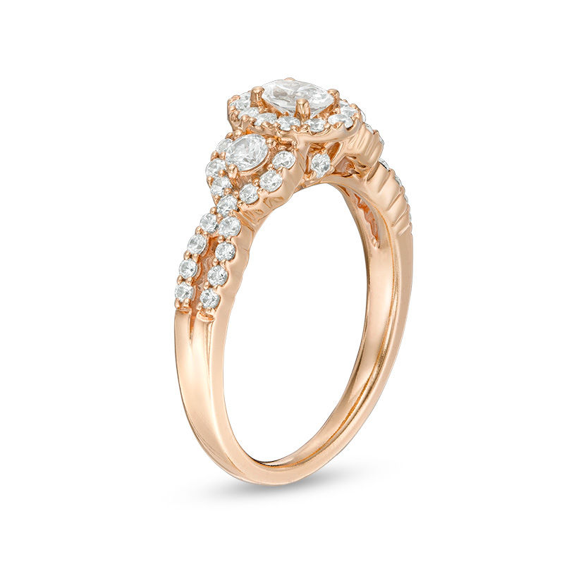 Celebration Ideal 1 CT. T.W. Oval Diamond Three Stone Frame Engagement Ring in 14K Rose Gold (I/I1)